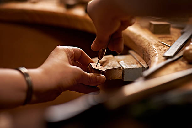 A person using a tool to work on a piece of woodhttp://195.154.178.81/DATA/i_collage/pi/shoots/783571.jpg